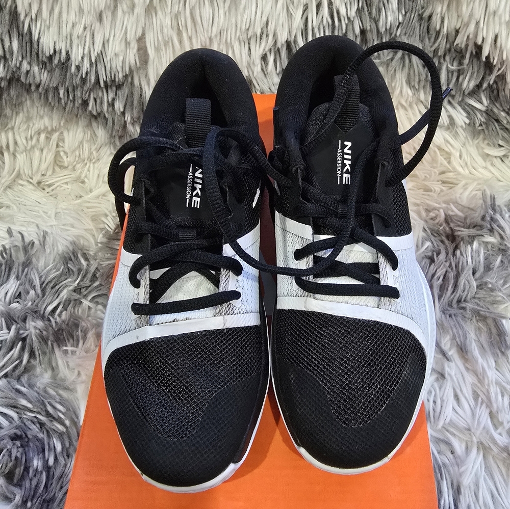 Brand new Nike Assersion Black and White Sneakers for youth.